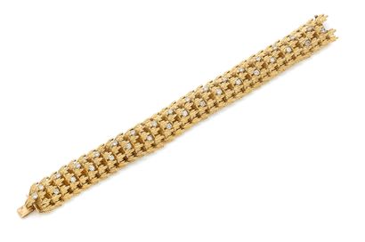 null Bracelet en or 18K (750), articulé de motifs feuillagés agrémentés de diamants...