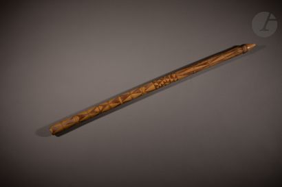 null Flute with two holes with engraved decorations, and a double projection in the...