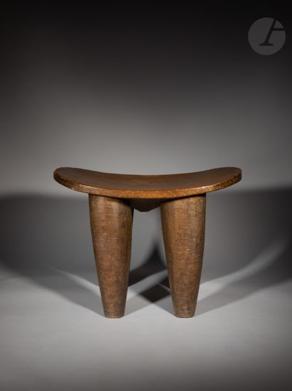 null Superb and ancient monumental kolo stool, the underside of the seat is carved...