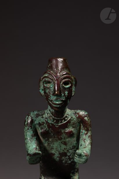 null Beautiful figurine in a seated position, and said in a gesture of peace, adorned...