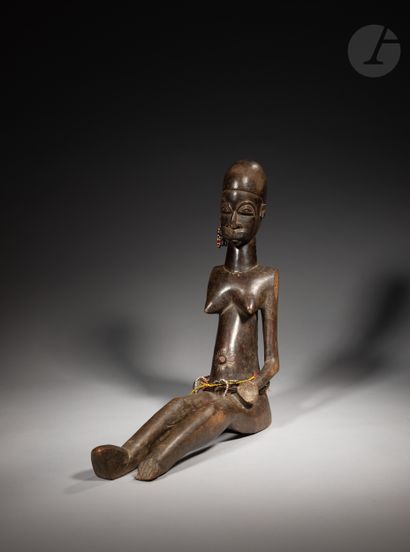 null Rare and ancient seated statuette holding a cup in the left hand.

This very...