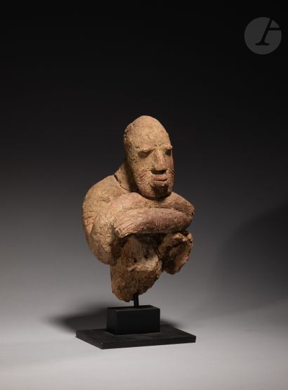 Fragmentary bust of a handsome figure, with...