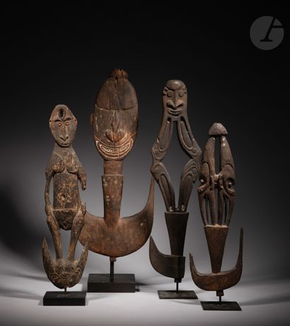 null Ancient sculpture of a suspension hook decorated with two masks back to back.

In...