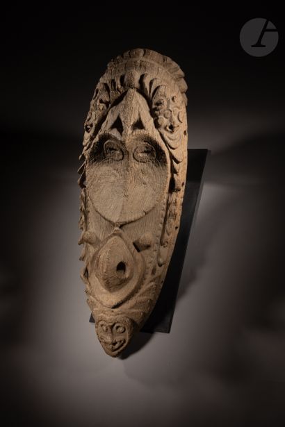 null Exceptional garamut drum front consisting of a large face in an elegant and...