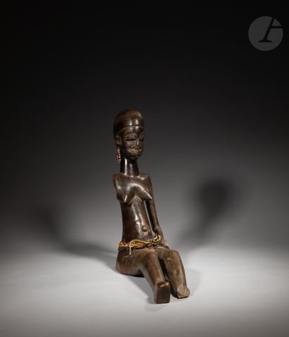 null Rare and ancient seated statuette holding a cup in the left hand.

This very...