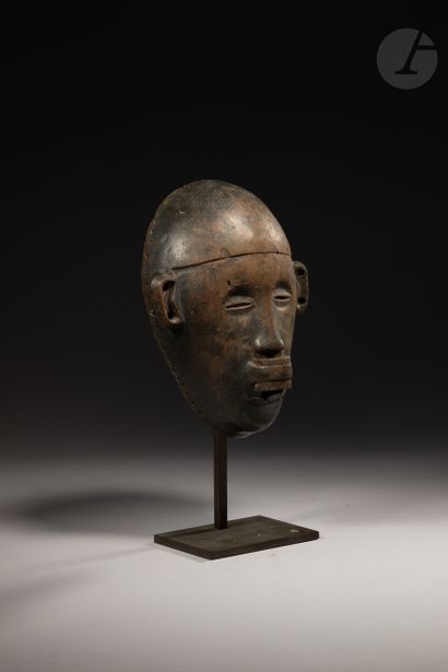 null Facial mask of the female type wearing a labret. 

Makonde, Tanzania

Wood,...