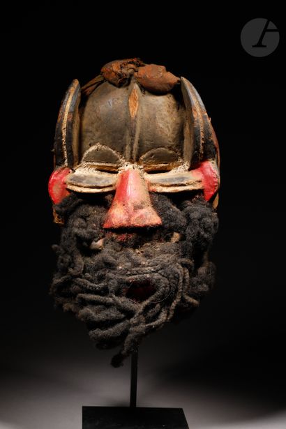 null Anthropo-zoomorphic mask with double eyes and two pairs of horns, one of which...