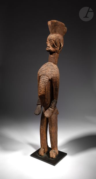 null Beautiful standing statue in offering position, the body and face scarified,...