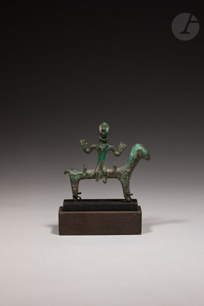 null Ancient representation of a rider, arms spread out, and sitting perpendicular...