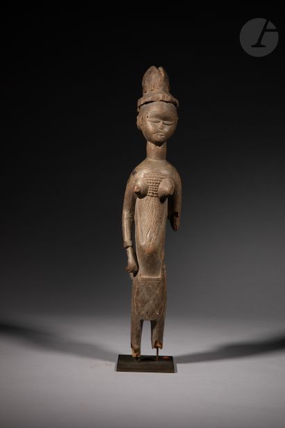 null An ancient female statuette of the Sande society, she wears the apron of the...