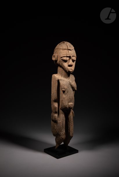 null A very old female Batéba statue, long planted on an altar, with arms along the...