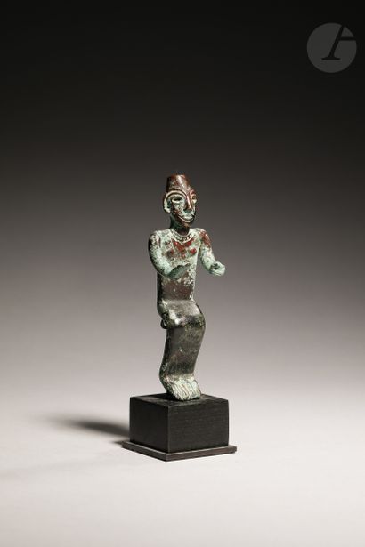 null Beautiful figurine in a seated position, and said in a gesture of peace, adorned...