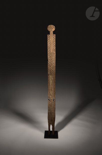 null Kikangu sculpture, designed to immortalize the deceased. The kikangu poles are...