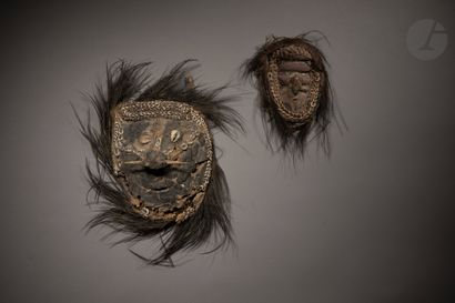 null A lot gathering two masks, one in clay modeled on rattan basketry and the other...