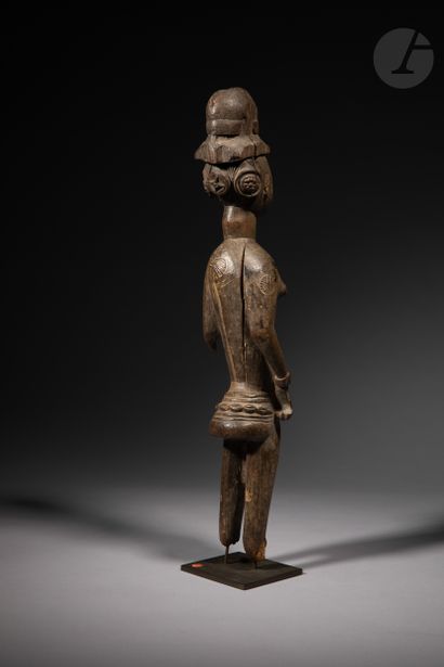 null An ancient female statuette of the Sande society, she wears the apron of the...