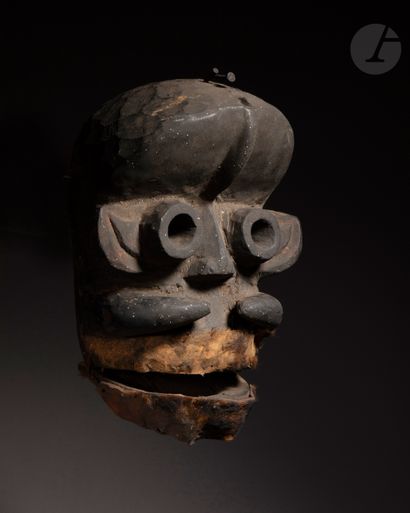 null An ancient anthropo-zoomorphic mask with an articulated mouth covered with animal...