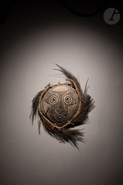 null Old and very expressive polychrome coconut mask. 

Coconut masks seemed to be...