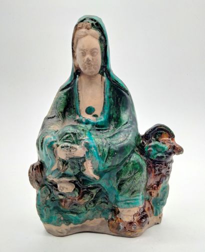 Statuette of Guanyin seated, in green and...