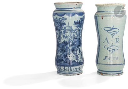 null Naples
Two slightly curved earthenware albarelli decorated in blue monochrome...
