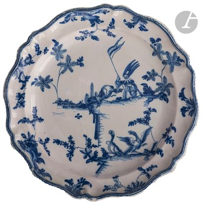 null Round earthenware dish with contoured edge decorated in blue monochrome with...