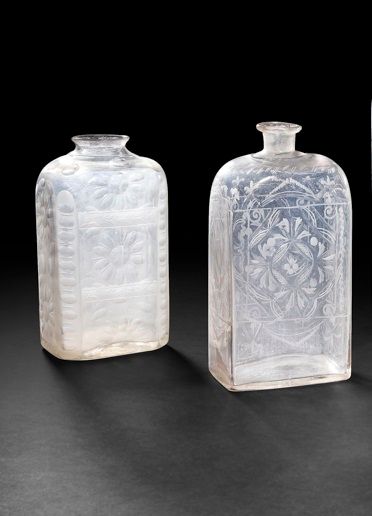 null Three bottles in molded glass, blown cut of round or oval pastilles forming...