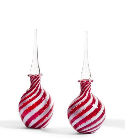 null Pair of glass bottles blown with multicolored spiral ribbons light red and white....