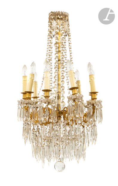 null A gilt bronze, cut and molded glass chandelier with twelve lights; (accidents,...