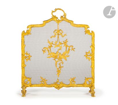 null Gilded bronze mantel screen decorated with doves and foliage.
End of the 19th...