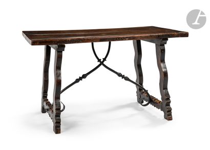 Table in walnut and wrought iron, the rectangular...