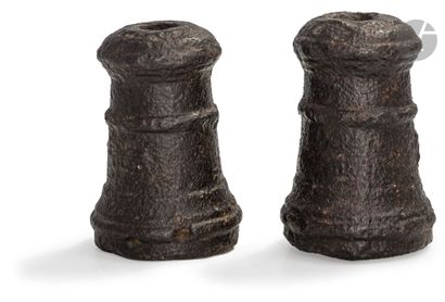  Two paired fire pots, round, in cast iron, with beading at the mouths and two reinforcing...