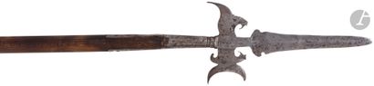 null 
Wrought iron halberd {CR}With median-edged estoc point. {CR}Crescent-backed...