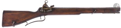  Flintlock rifle. {CR}Sided rifled barrel with rear sight. Miquelet style lock, lined...
