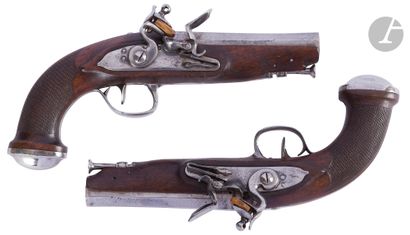 null 
Pair of travel flintlock pistols. {CR}Barrels with sides, decorated with silver...