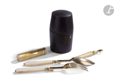 null A gilt and mother-of-pearl travel set contained in a hinged leather "barrel"...