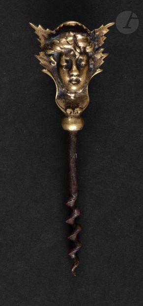 null Simple corkscrew, the bronze handle showing a head in foliage.

Height : 13...