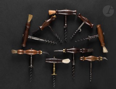 null Lot of nine simple corkscrews with wooden handles. One model is the copy of...