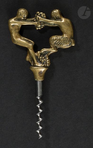 null Simple iron corkscrew, the handle showing a man and a satyr treading grapes.

Marked...
