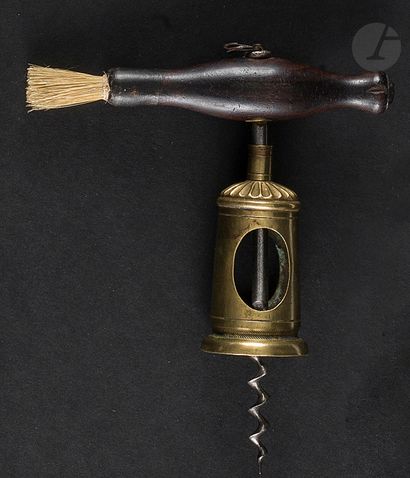 null Corkscrew with openwork brass cage and turned wooden handle with brush.

Height:...