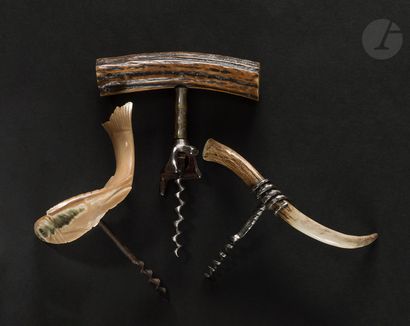 null Three corkscrews, one with a short bell, the handles in horn (fish) or deer...