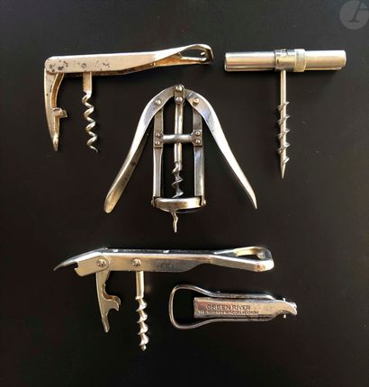 null Lot of five various corkscrews.

Three models of wine waiters, a model with...