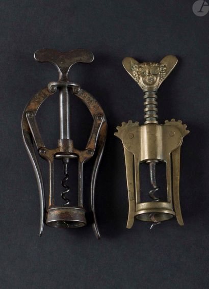 null Two corkscrews with double lever:

- A French brass marked " BACCHUS MADE IN...