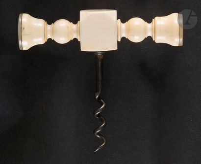 Simple iron corkscrew, the ivory handle turned...