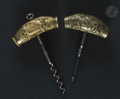 null Corkscrew and a punch, the bronze handle decorated with barrels, vine and grapes.

One...