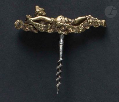 null Simple corkscrew, the bronze handle showing a bacchus lying on grapes.

Height:...