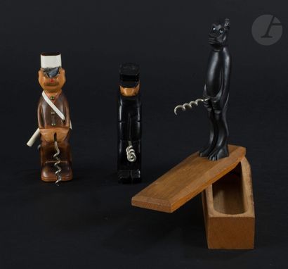 null Lot of three wooden corkscrews type "PISSEUR" in carved wood showing two gendarmes...