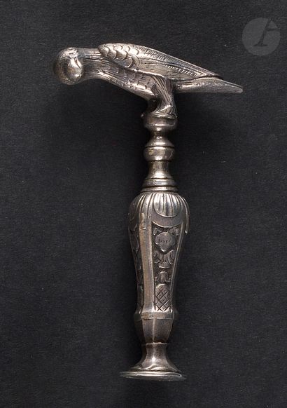 Silver corkscrew. With a wick guard in the...
