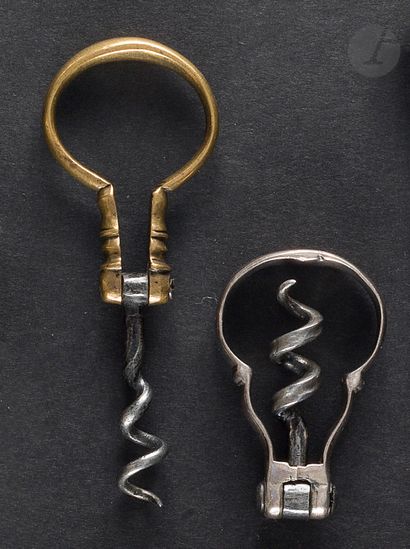 null Two folding corkscrews of the harp type, the catch in brass or silver, one bearing...