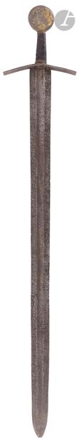 null Medieval style sword 
Mounted with a two-edged blade and median gutter, bearing...
