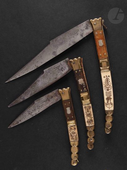  Three folding knives of the "NAVAJAS" type, the handles in brass, bone and horn...