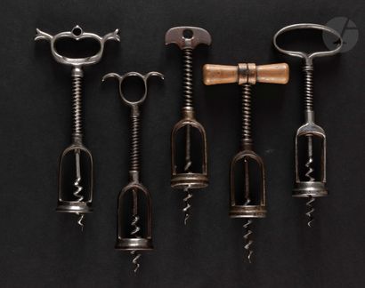  Five corkscrews with iron cage and spring, the handles in wood or metal. Accident...